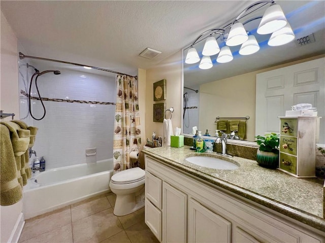 full bathroom with vanity, tile patterned floors, toilet, a textured ceiling, and shower / tub combo with curtain