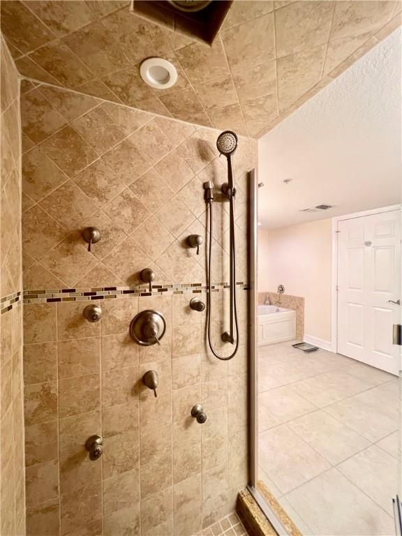 bathroom with a tile shower