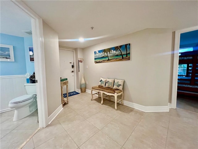 corridor featuring light tile patterned flooring