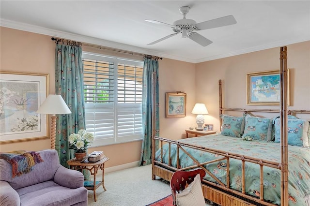 carpeted bedroom featuring crown molding and ceiling fan