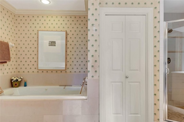 bathroom with ornamental molding and shower with separate bathtub