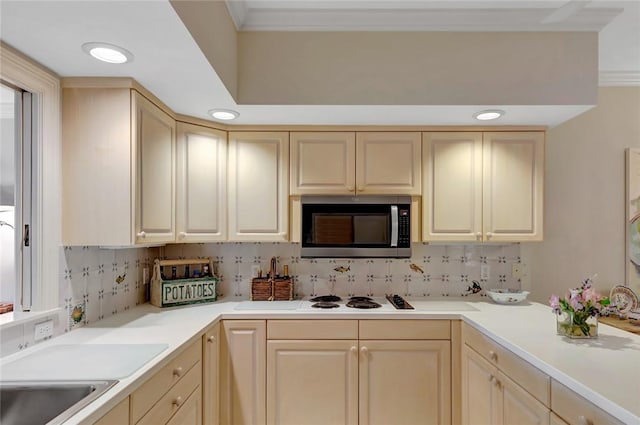 kitchen with white stovetop, decorative backsplash, and ornamental molding