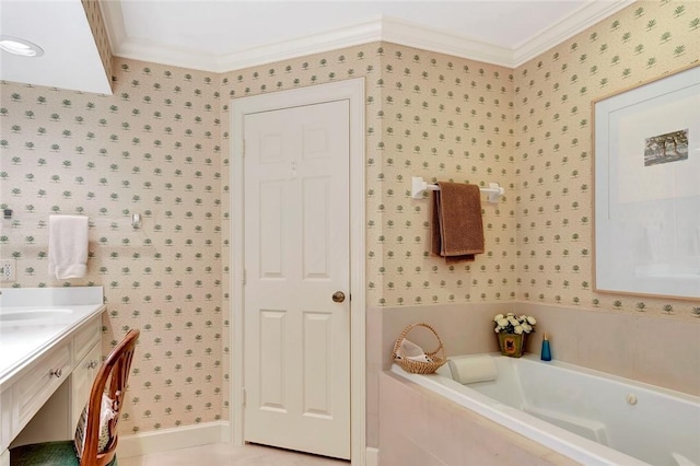 bathroom featuring vanity, ornamental molding, and tiled bath