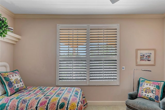 bedroom featuring crown molding and carpet flooring