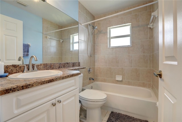 1158 Laconia St, Sebastian, FL 32958 - full bathroom with visible vents, toilet, shower / tub combination, vanity, and tile patterned floors