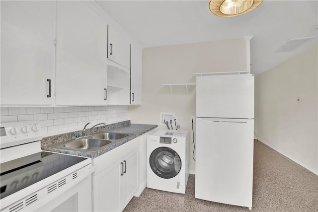 clothes washing area with washer / clothes dryer and sink