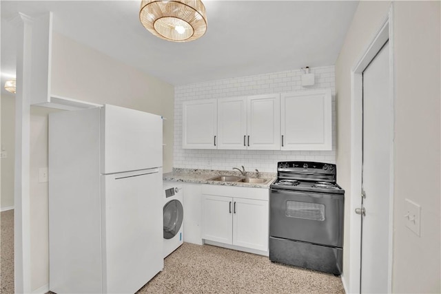 interior space with washer / clothes dryer and sink