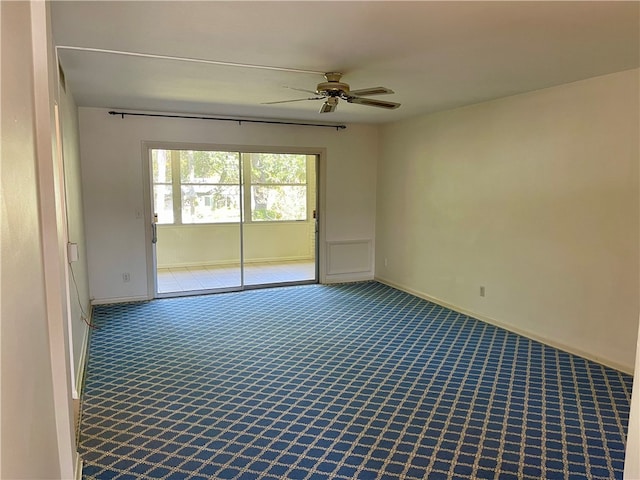 carpeted empty room with ceiling fan