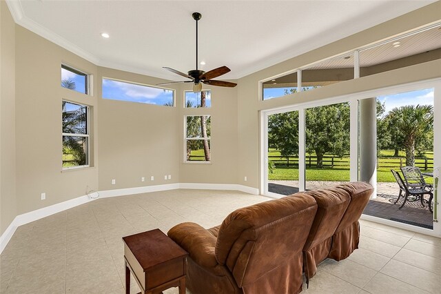 interior space with ceiling fan