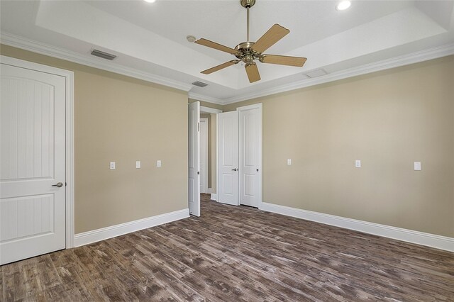 unfurnished bedroom featuring crown molding, ceiling fan, and a tray ceiling