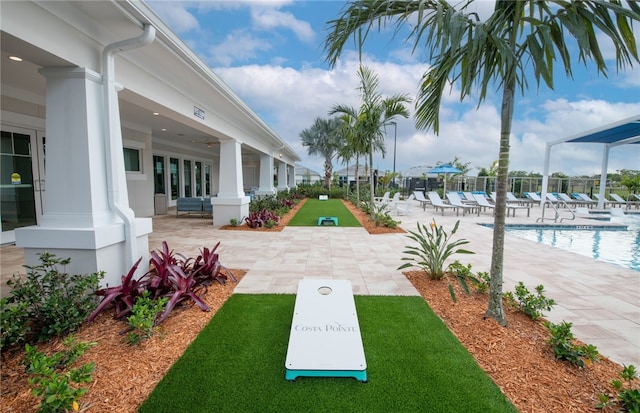 1209 Harper Way Unit 009, Vero Beach, FL 32960 - view of yard featuring a community pool, a patio, and fence
