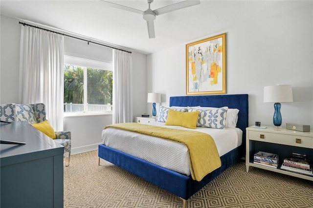 bedroom with ceiling fan and carpet flooring