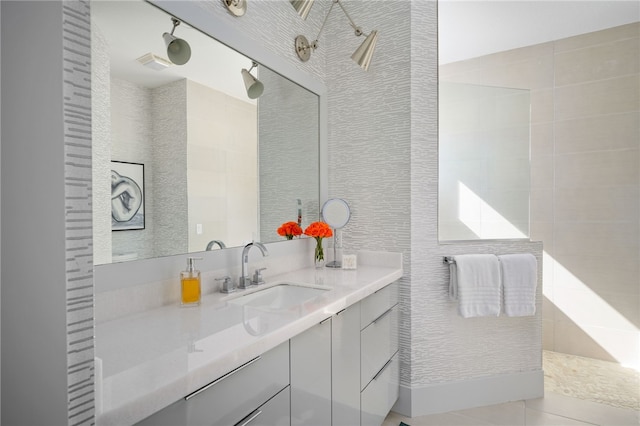 bathroom featuring vanity, tile walls, and tile patterned floors