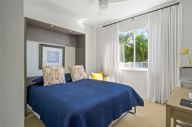 bedroom with ceiling fan and carpet floors