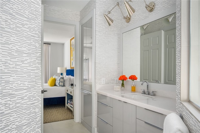 bathroom featuring tile patterned floors and vanity