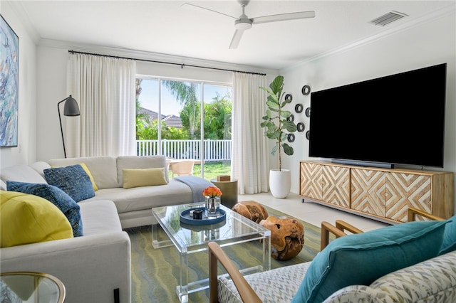 living room with crown molding and ceiling fan