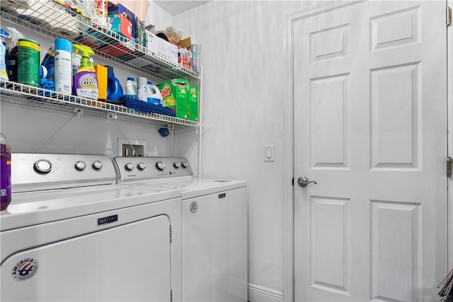 laundry area with laundry area and washer and clothes dryer