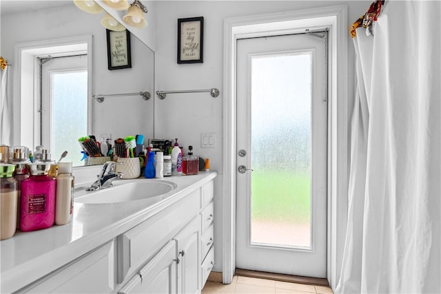 bathroom with vanity and tile patterned flooring