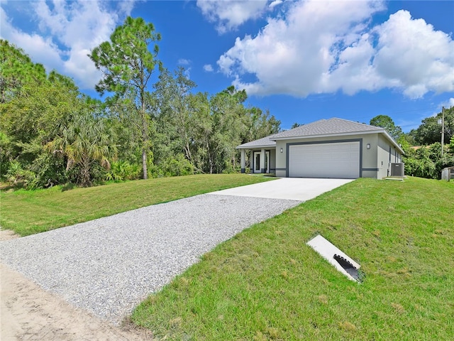 view of front facade featuring a garage and a front lawn