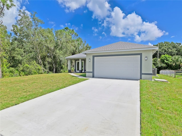 view of front facade featuring central AC unit, a garage, and a front lawn