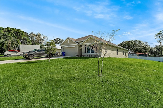 view of front facade with a front lawn and a garage