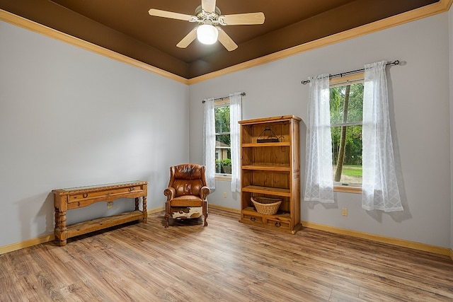 sitting room with plenty of natural light, ceiling fan, and light hardwood / wood-style flooring