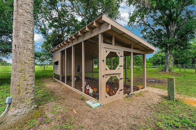 view of outbuilding featuring a yard