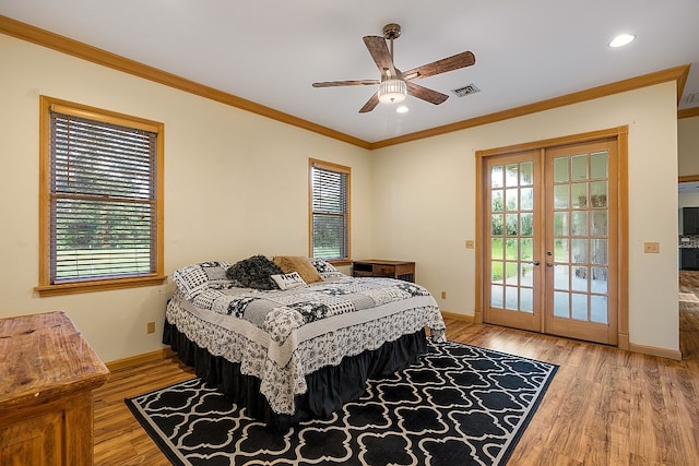 bedroom with ceiling fan, access to exterior, light hardwood / wood-style flooring, crown molding, and french doors