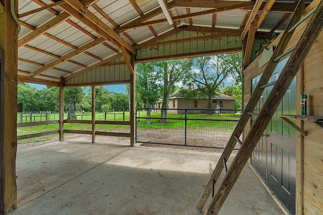 unfurnished sunroom with lofted ceiling