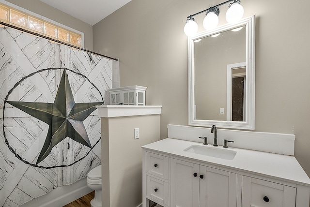 full bathroom with vanity, shower / bath combo with shower curtain, toilet, and wood-type flooring