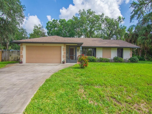 321 Browning Ter, Sebastian, FL 32958 - ranch-style home with stucco siding, an attached garage, and driveway