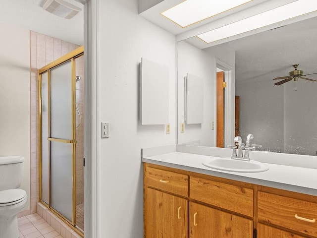 321 Browning Ter, Sebastian, FL 32958 - bathroom with a stall shower, vanity, ceiling fan, and tile patterned floors