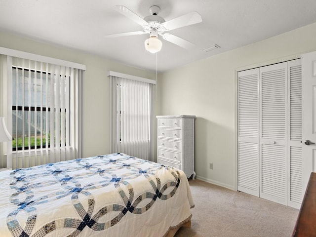 636 Centre Ct SW Unit 102, Vero Beach, FL 32962 - carpeted bedroom with a closet, baseboards, and ceiling fan