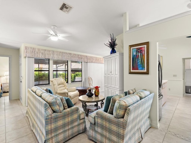 636 Centre Ct SW Unit 102, Vero Beach, FL 32962 - living room featuring light tile patterned flooring, a ceiling fan, and baseboards