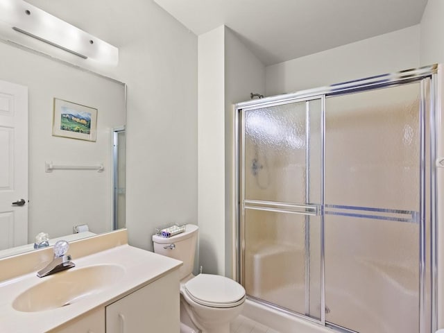636 Centre Ct SW Unit 102, Vero Beach, FL 32962 - bathroom with a stall shower, toilet, and vanity
