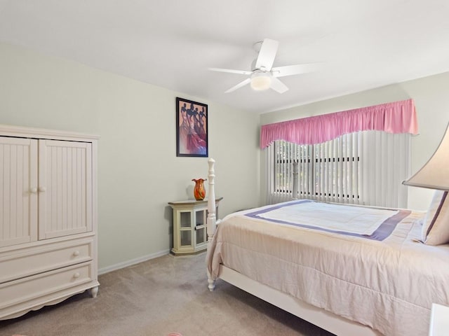 636 Centre Ct SW Unit 102, Vero Beach, FL 32962 - bedroom with carpet floors, baseboards, and a ceiling fan
