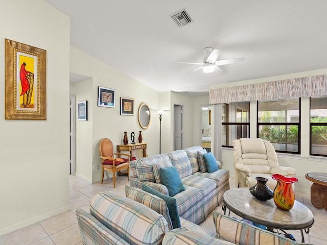 636 Centre Ct SW Unit 102, Vero Beach, FL 32962 - living room with light tile patterned floors, ceiling fan, and baseboards