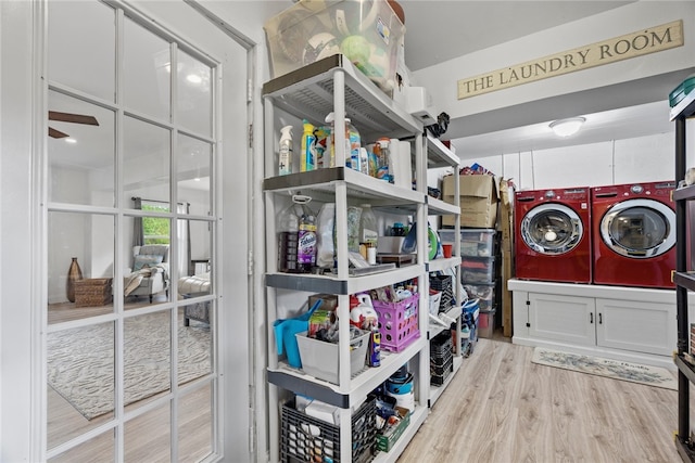 clothes washing area featuring washer and dryer, light hardwood / wood-style floors, and ceiling fan