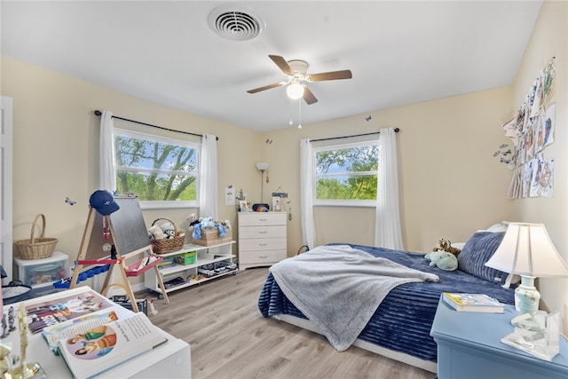 bedroom featuring hardwood / wood-style flooring and ceiling fan