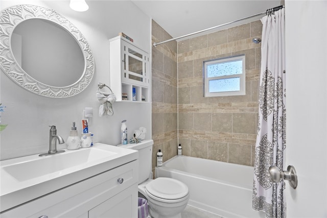 full bathroom featuring vanity, shower / tub combo, and toilet