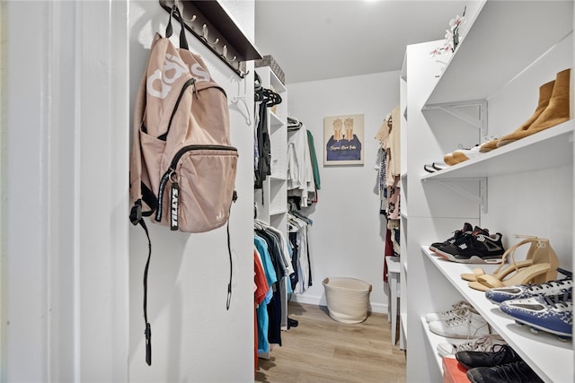 spacious closet featuring light hardwood / wood-style floors