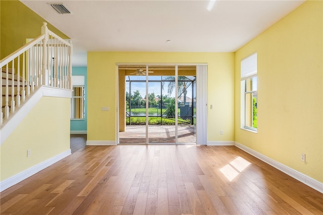 unfurnished room with wood-type flooring