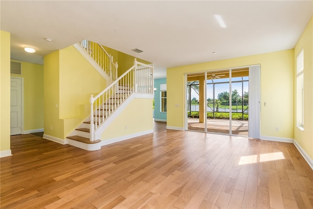 unfurnished living room with light wood-type flooring