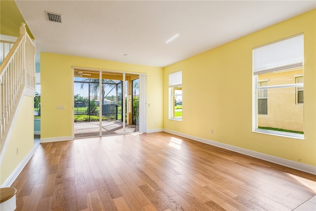 empty room with light hardwood / wood-style floors