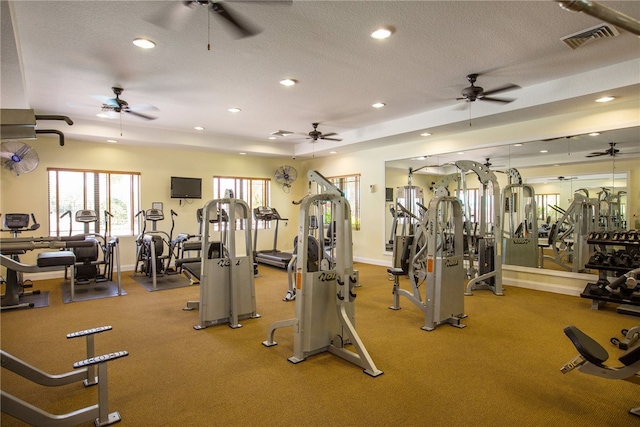 gym featuring a textured ceiling