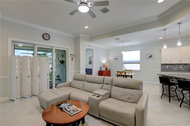 6005 Bella Rosa Ln, Vero Beach, FL 32966 - living room featuring crown molding, ceiling fan, a wainscoted wall, recessed lighting, and a decorative wall