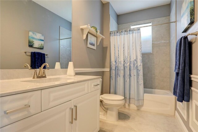 6005 Bella Rosa Ln, Vero Beach, FL 32966 - full bath featuring vanity, toilet, shower / tub combo with curtain, and tile patterned flooring