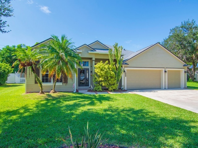 view of front facade featuring a garage and a front yard