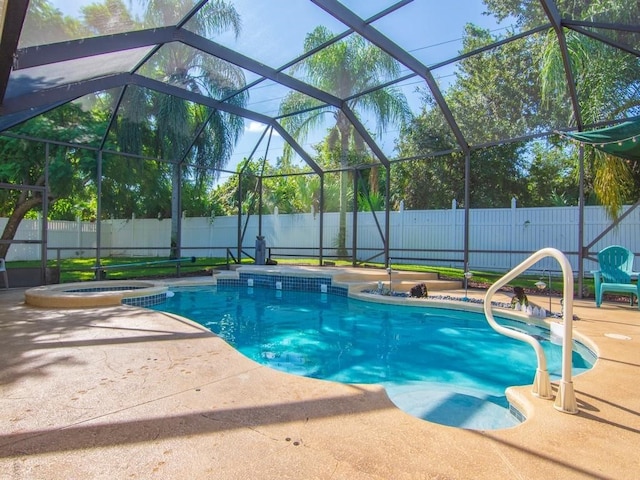 view of swimming pool with a patio area, glass enclosure, and an in ground hot tub