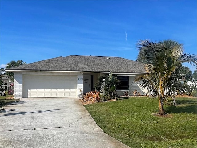 single story home with a garage and a front lawn